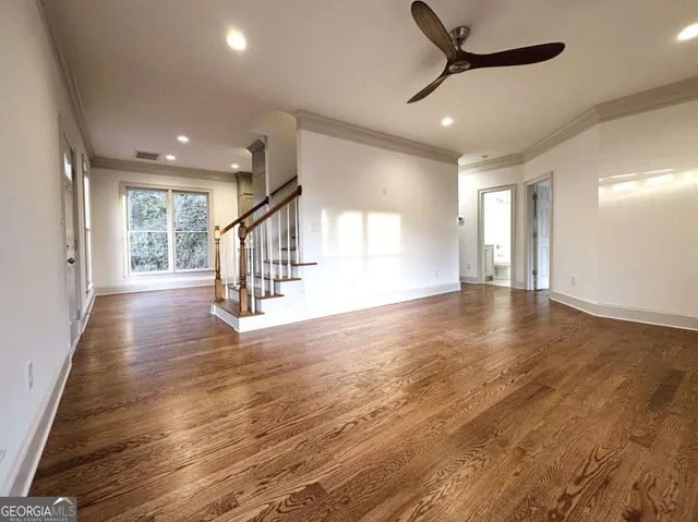 a view of an entryway with wooden floor