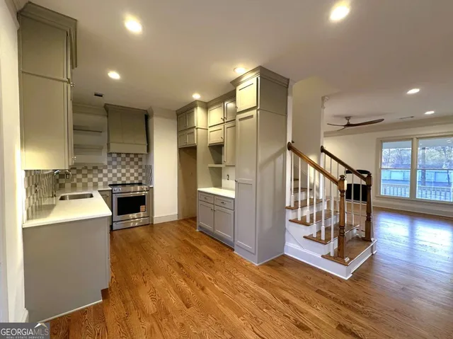 a view of entryway and hall with wooden floor