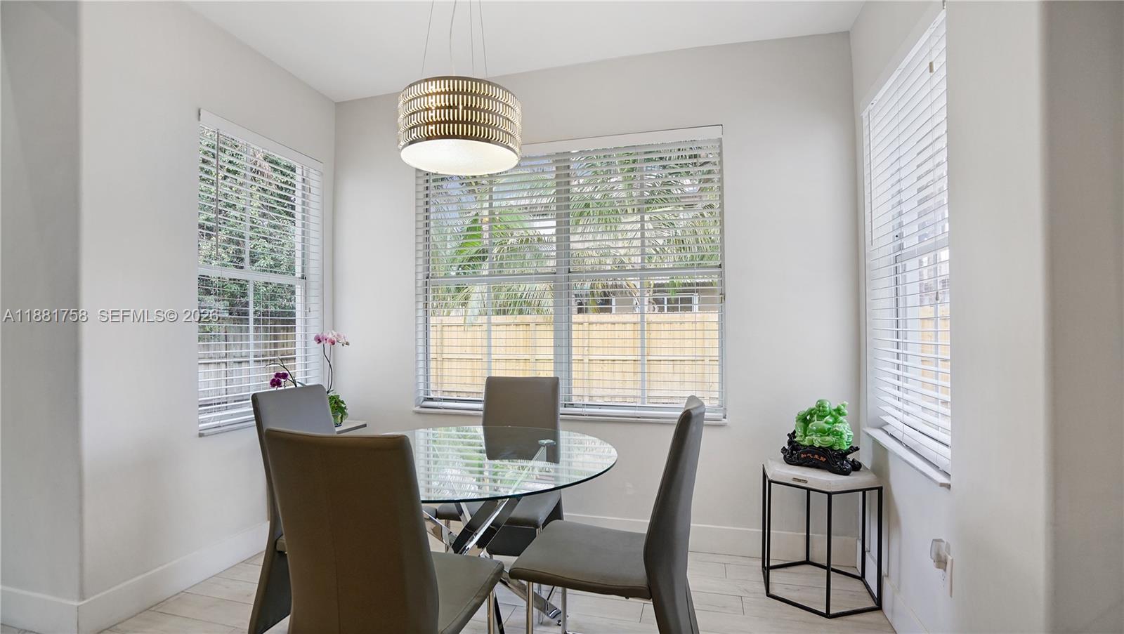 704 Northwest 129th Court Miami, FL 33182 - Photo 14 of 58 a view of a dining room with furniture window and outside view
