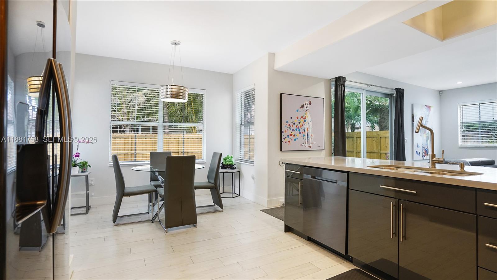 704 Northwest 129th Court Miami, FL 33182 - Photo 15 of 58 a view of a dining room with furniture window and outside view