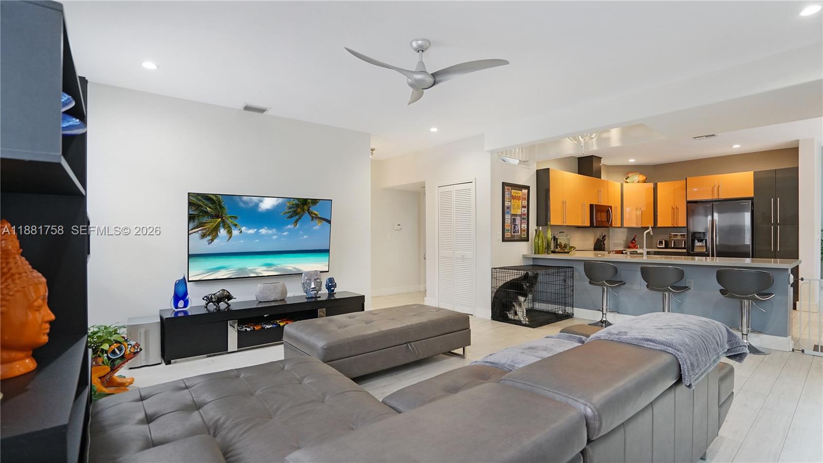 704 Northwest 129th Court Miami, FL 33182 - Photo 18 of 58 a bedroom with furniture and a flat screen tv