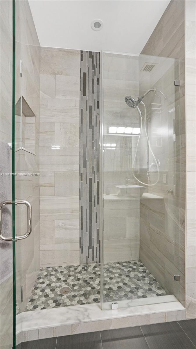704 Northwest 129th Court Miami, FL 33182 - Photo 21 of 58 a bathroom with a shower