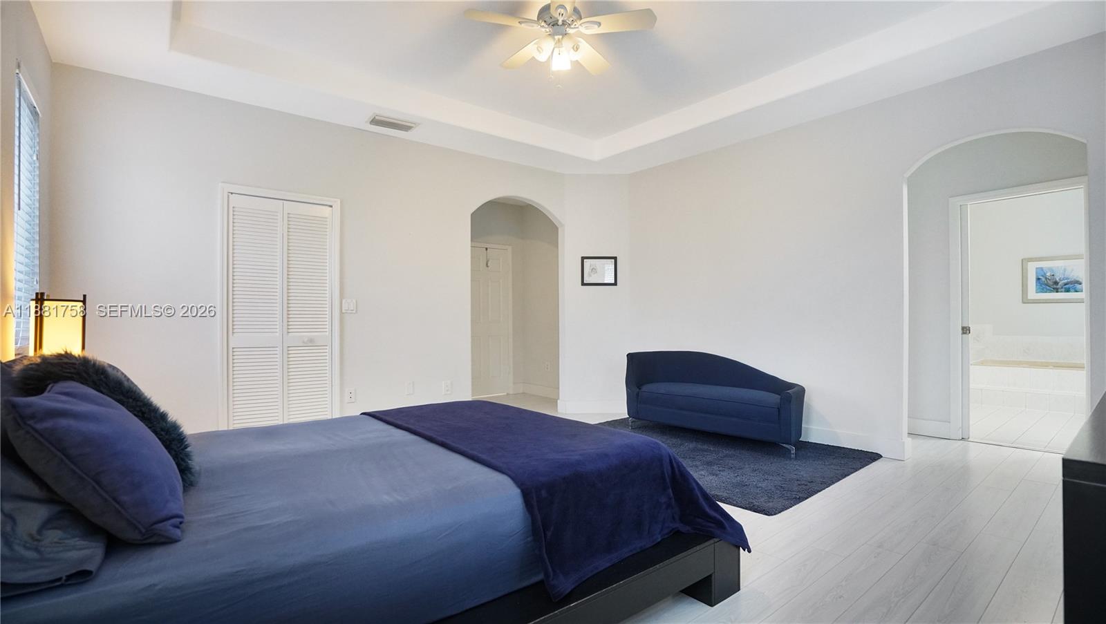 704 Northwest 129th Court Miami, FL 33182 - Photo 34 of 58 a bedroom with a bed and window