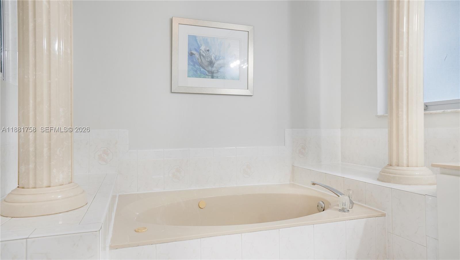 704 Northwest 129th Court Miami, FL 33182 - Photo 37 of 58 a white bath tub and a shower