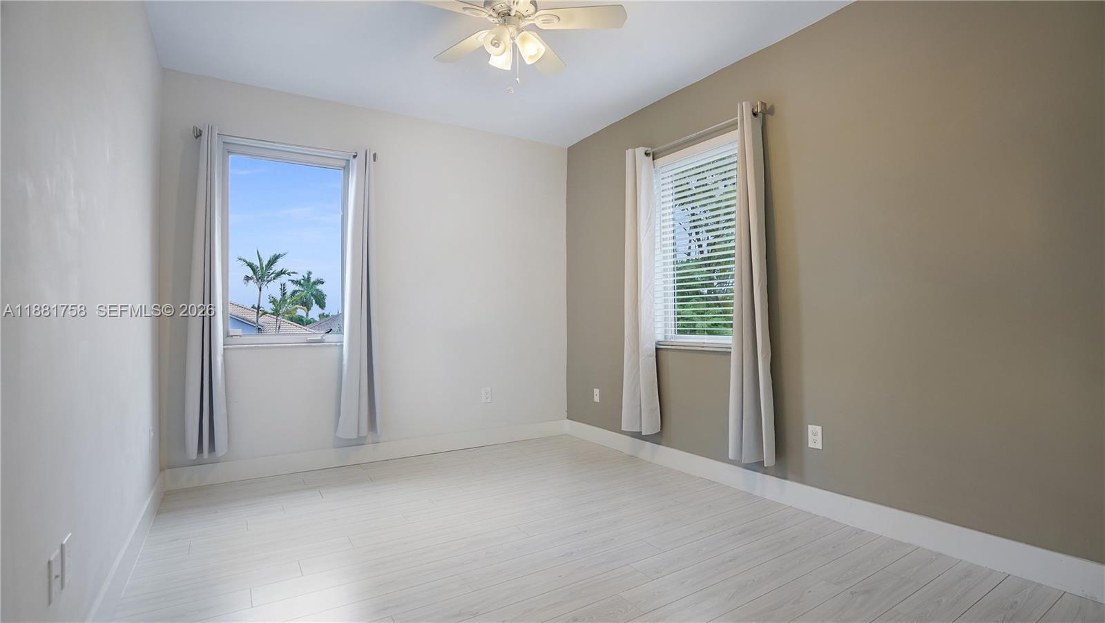 704 Northwest 129th Court Miami, FL 33182 - Photo 39 of 58 a view of an empty room with a window