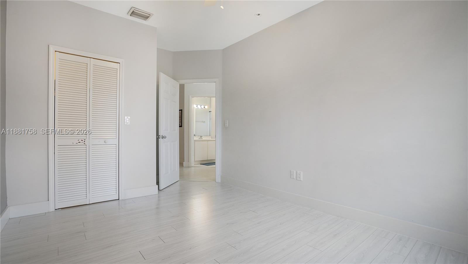 704 Northwest 129th Court Miami, FL 33182 - Photo 40 of 58 a view of an empty room