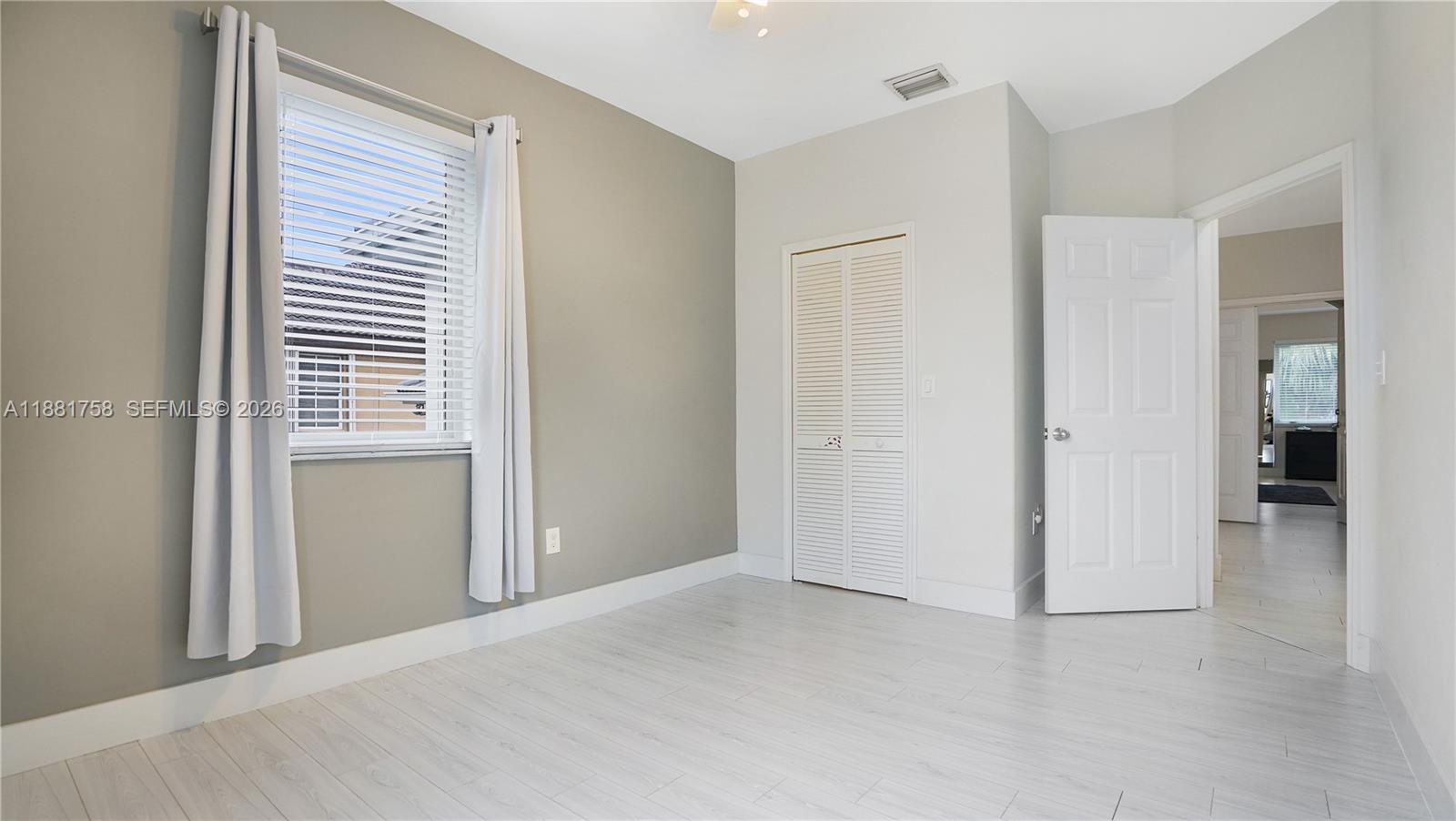 704 Northwest 129th Court Miami, FL 33182 - Photo 41 of 58 an empty room with windows