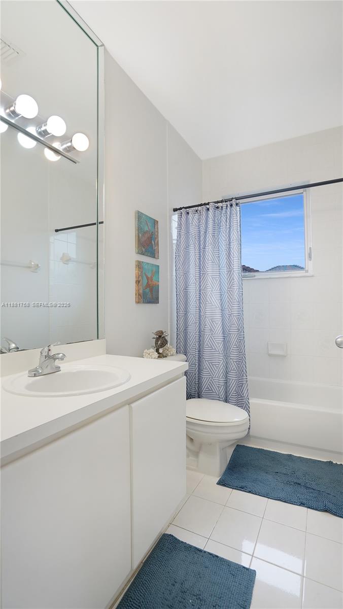 704 Northwest 129th Court Miami, FL 33182 - Photo 43 of 58 a bathroom with a sink a toilet and shower