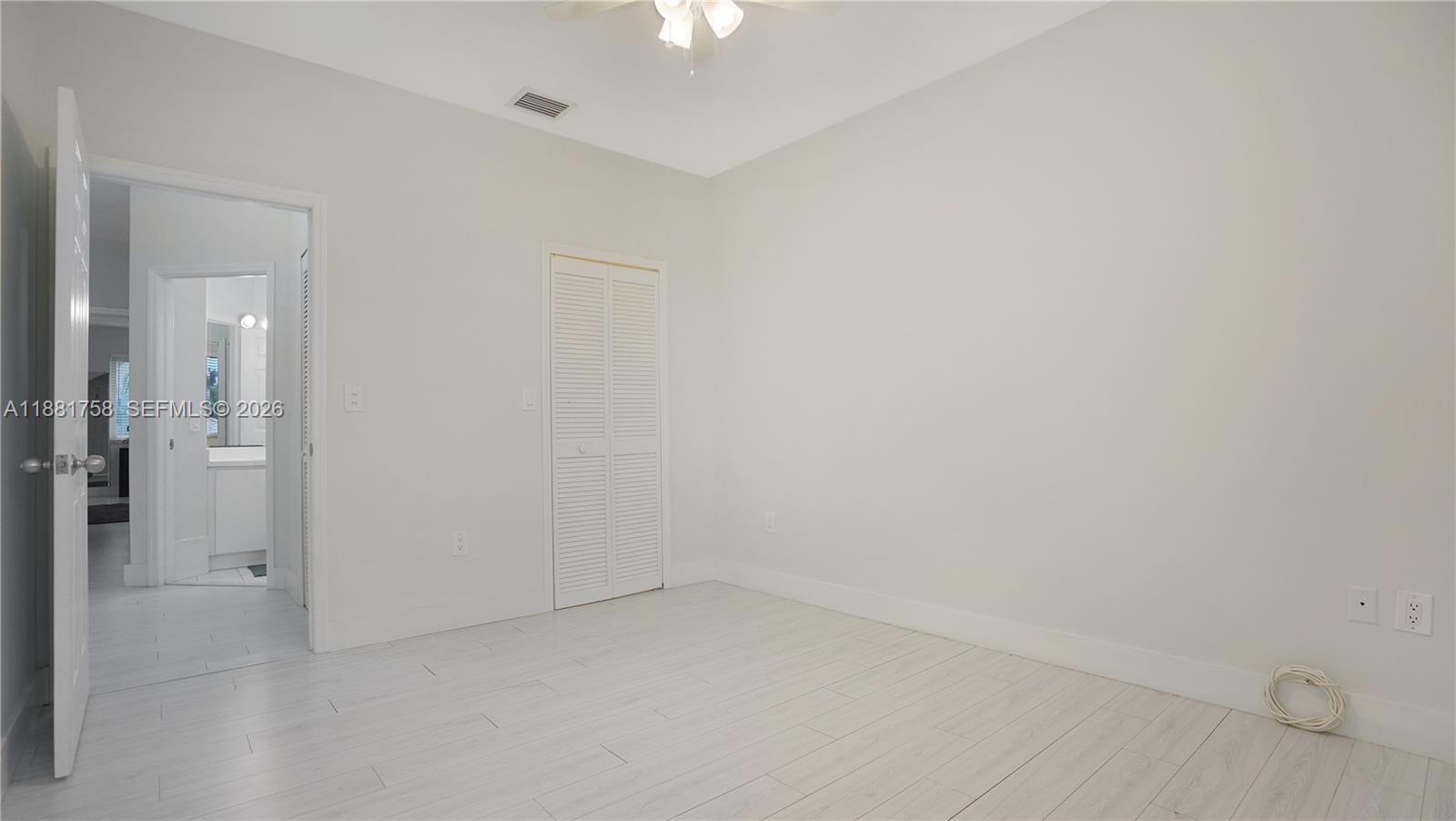 704 Northwest 129th Court Miami, FL 33182 - Photo 46 of 58 wooden floor in an empty room