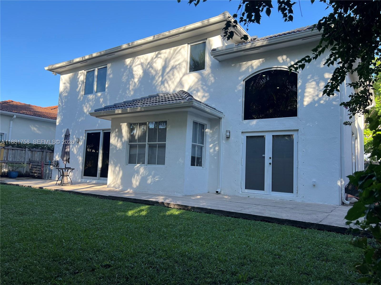 704 Northwest 129th Court Miami, FL 33182 - Photo 53 of 58 a view of house with yard