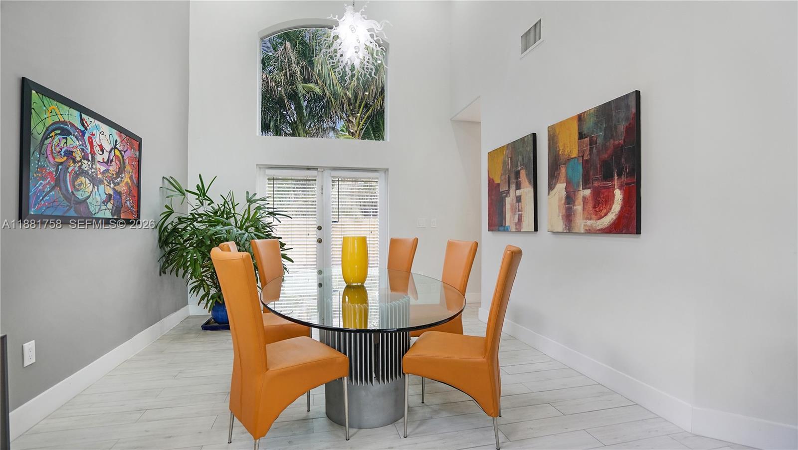 704 Northwest 129th Court Miami, FL 33182 - Photo 7 of 58 a dining room with furniture and window
