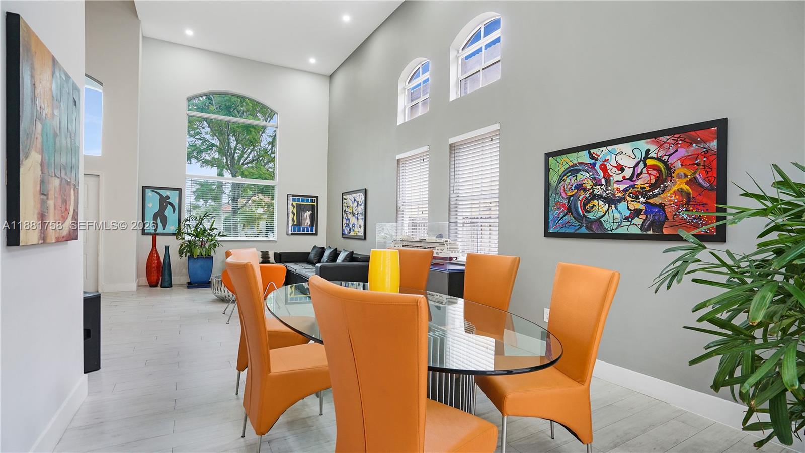 704 Northwest 129th Court Miami, FL 33182 - Photo 9 of 58 a living room with furniture a couch and a potted plant