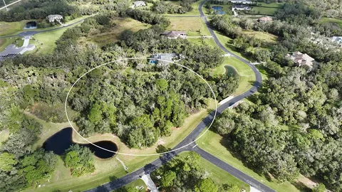 an aerial view of residential house with an outdoor space