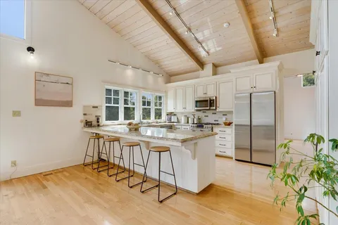 a kitchen with counter top space and appliances