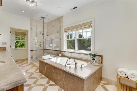 a bath tub sitting next to a window