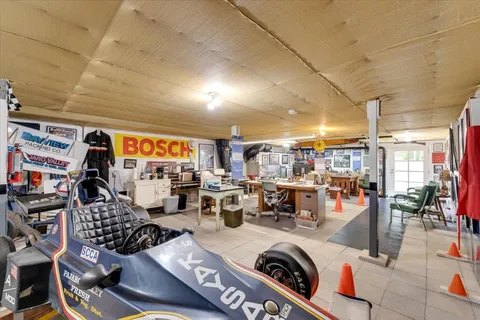 a living room with lots of furniture and a view of bedroom
