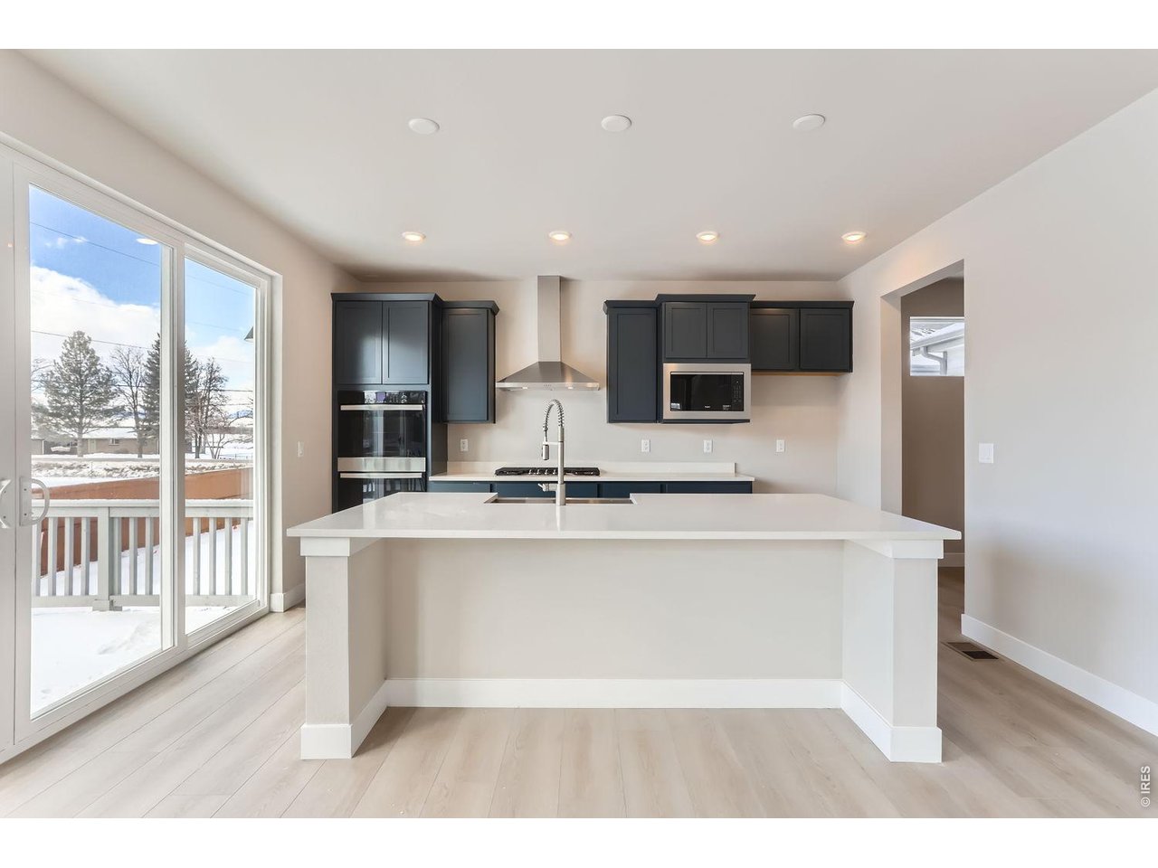 364 Rustic Barn Lane Berthoud, CO 80513 - Photo 9 of 40 Kitchen - with upgraded Kohler fixtures and designer tile backsplash