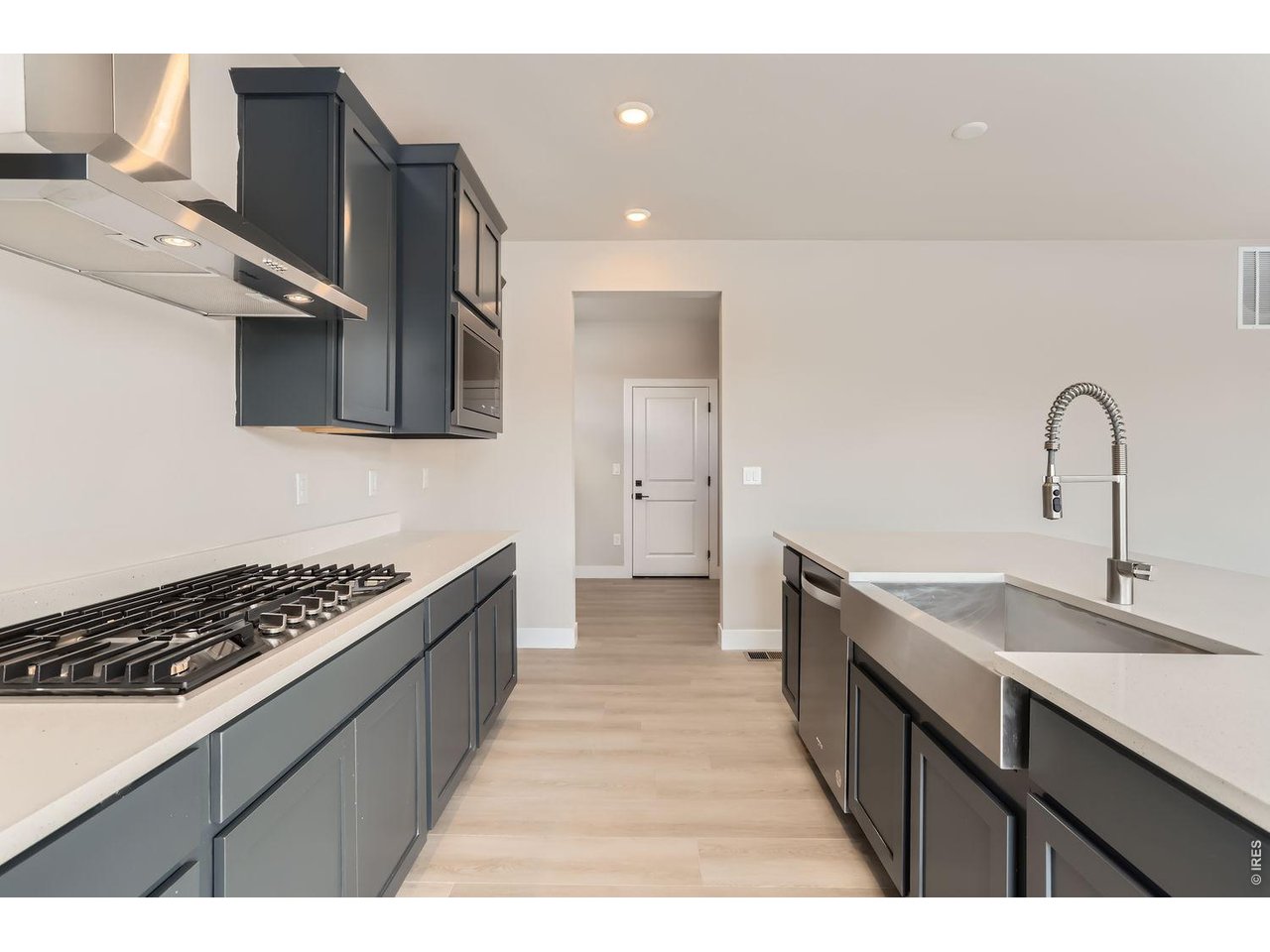 364 Rustic Barn Lane Berthoud, CO 80513 - Photo 11 of 40 Kitchen - with upgraded Kohler fixtures and designer tile backsplash