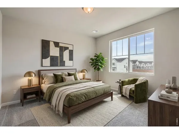 a living room with furniture and a walk in closet
