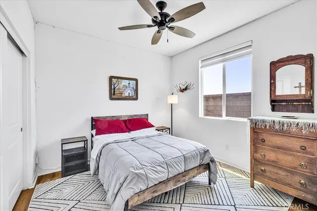 a bedroom with a bed and a dresser