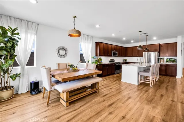 a living room with furniture and a kitchen view