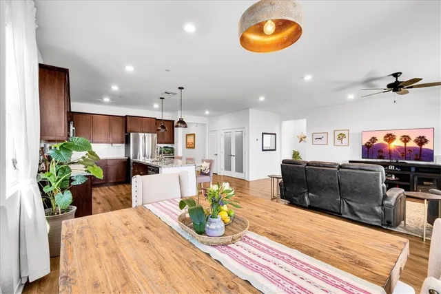 a living room filled with furniture and a chandelier