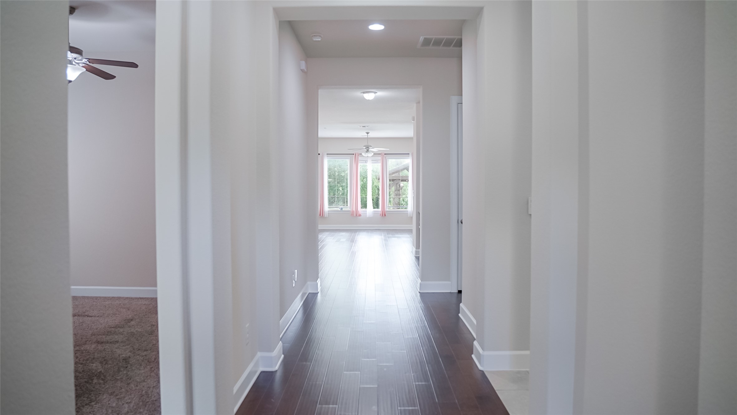 184 Fort Cobb Way Georgetown, TX 78628 - Photo 9 of 33 a view of a hallway with wooden floor