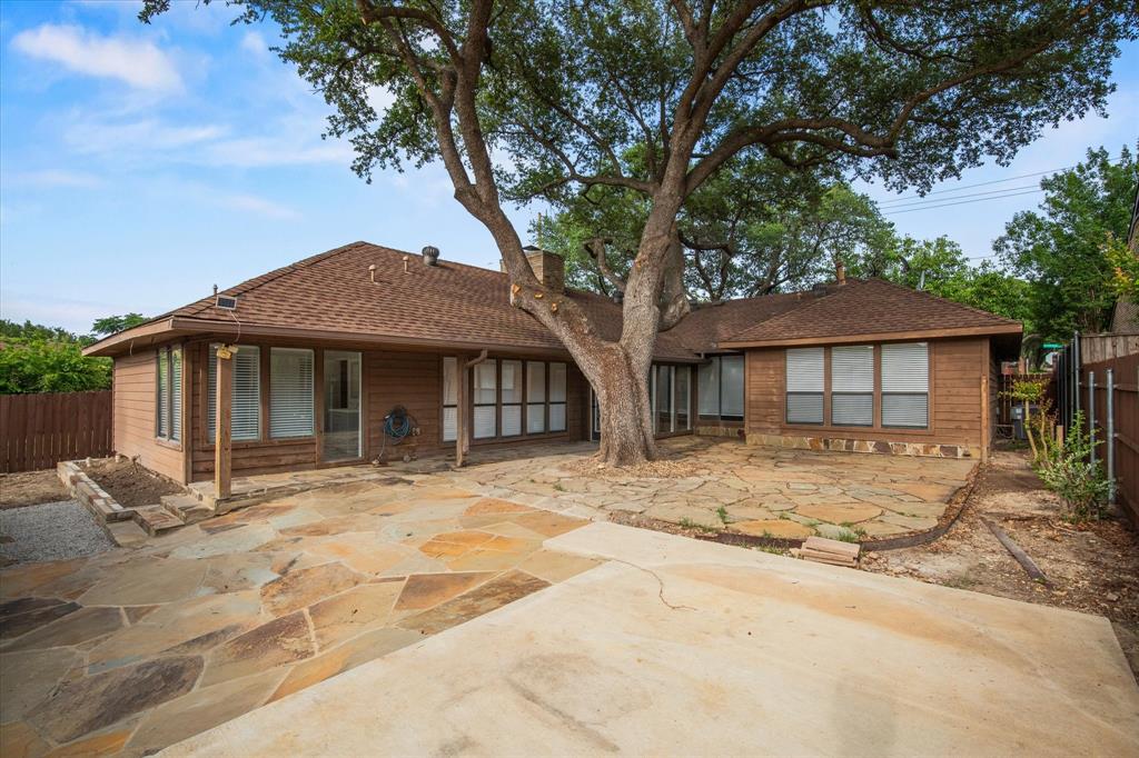 17003 Davenport Road Dallas, TX 75248 - Photo 40 of 40 a front view of a house with a yard