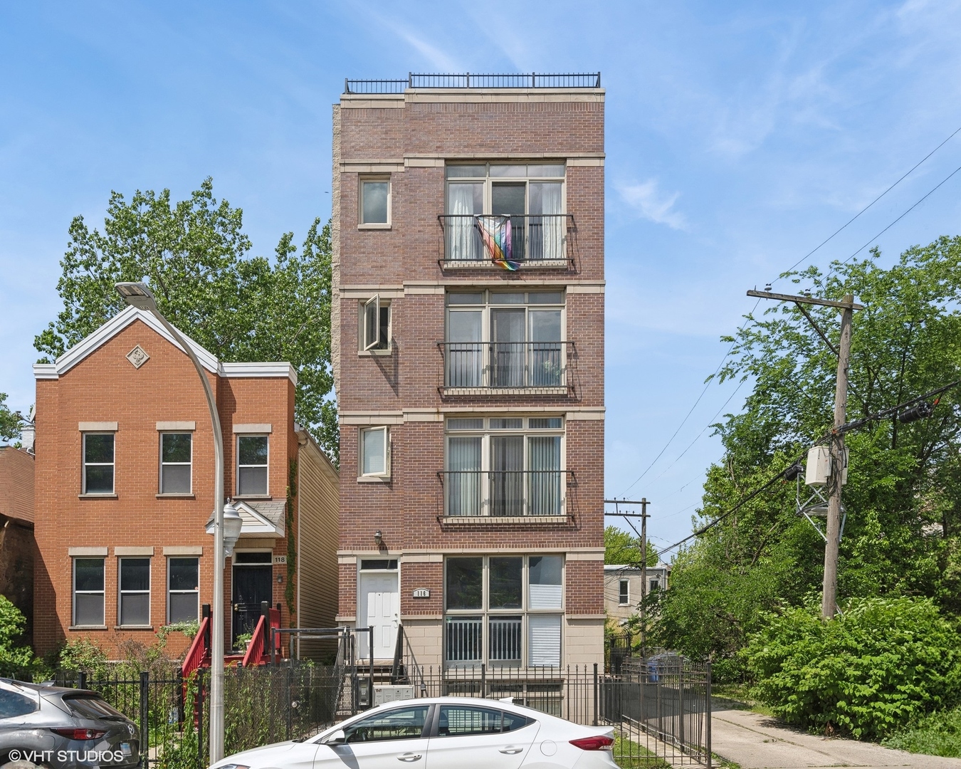 a front view of a residential apartment building with a yard