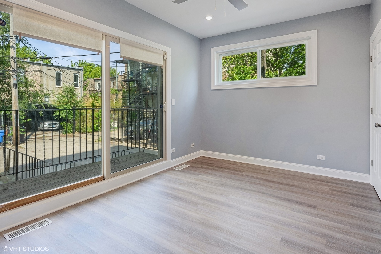 116 South Bell Avenue, Unit 1 Chicago, IL 60612 - Photo 11 of 30 a view of an empty room with wooden floor and windows