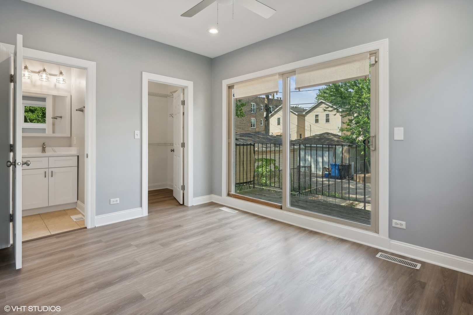 116 South Bell Avenue, Unit 1 Chicago, IL 60612 - Photo 12 of 30 an empty room with wooden floor and windows