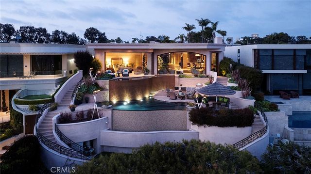 a view of swimming pool with outdoor seating and a potted plant