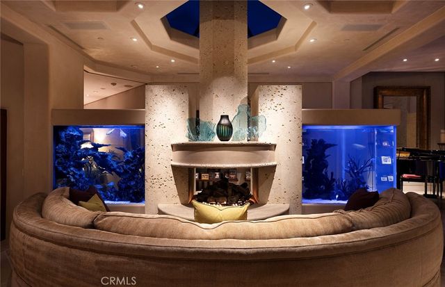 a balcony with furniture and a fireplace