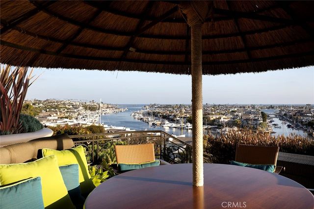 an aerial view of residential houses with city view