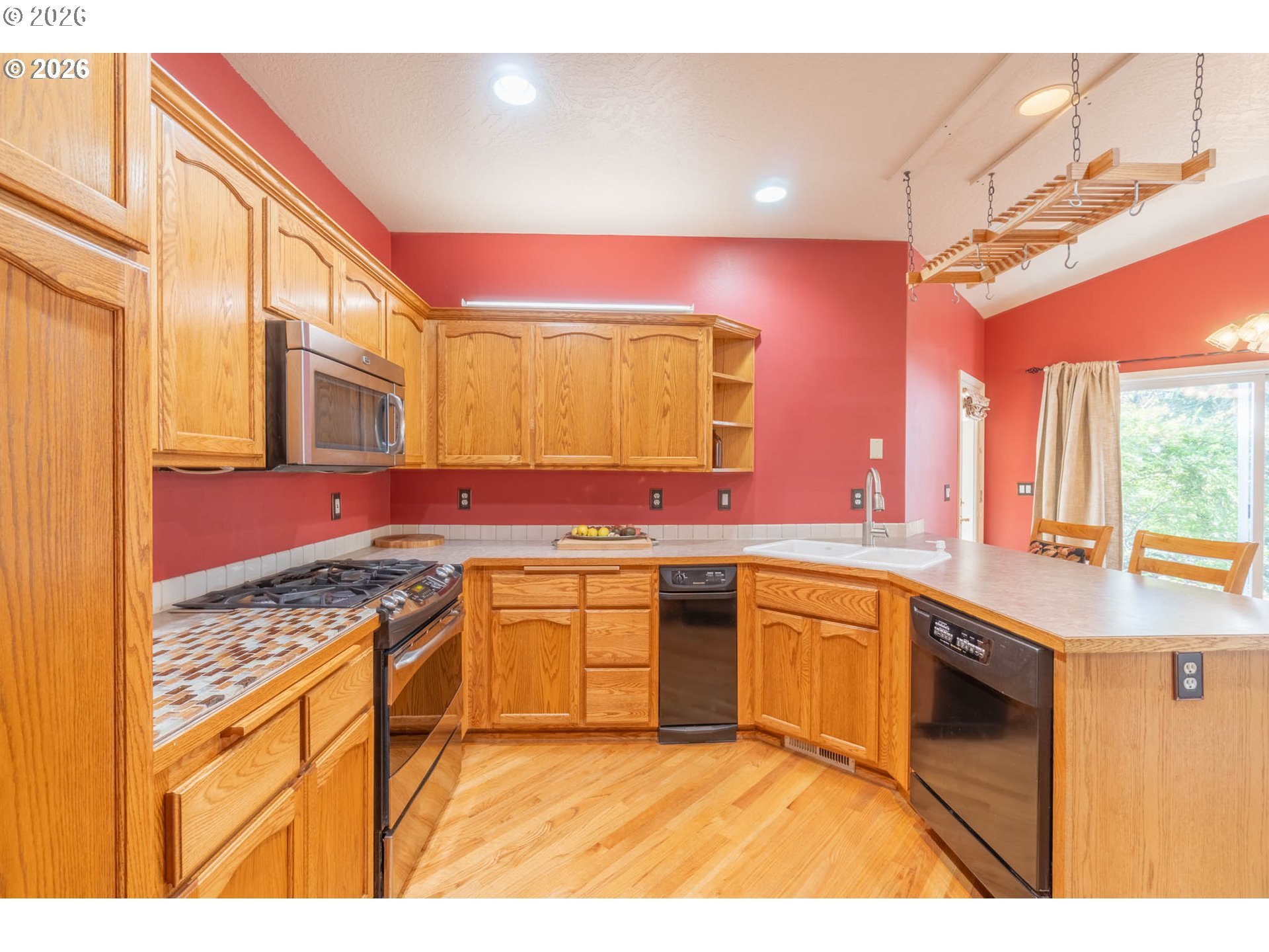 4366 Berry Lane Eugene, OR 97404 - Photo 11 of 36 a kitchen with stainless steel appliances granite countertop a sink stove and cabinets