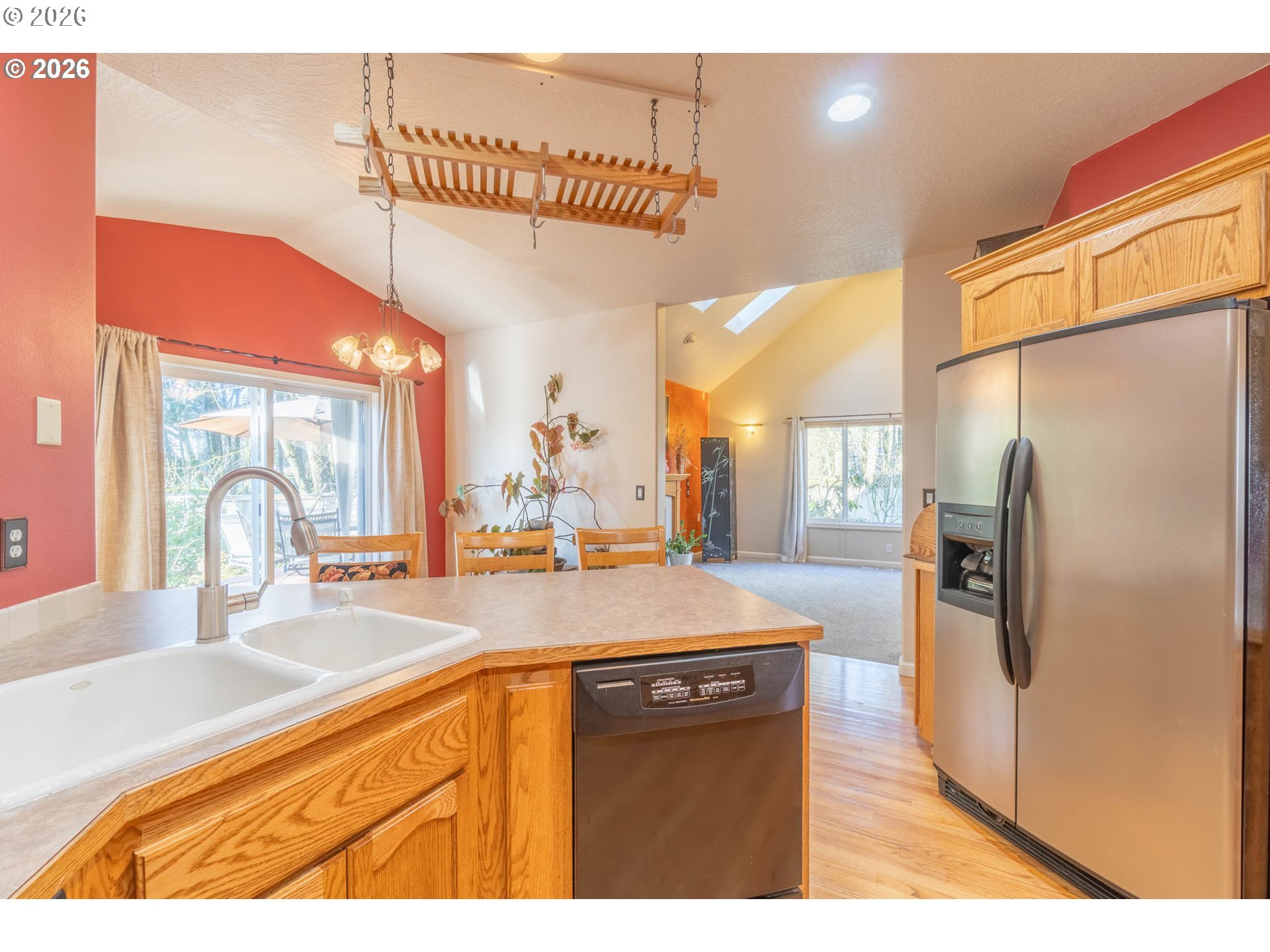 4366 Berry Lane Eugene, OR 97404 - Photo 14 of 36 a kitchen with stainless steel appliances granite countertop a sink and a refrigerator