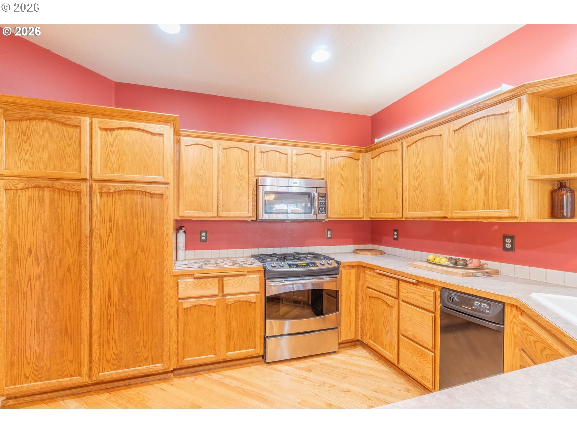 4366 Berry Lane Eugene, OR 97404 - Photo 15 of 36 a kitchen with stainless steel appliances granite countertop a sink and cabinets
