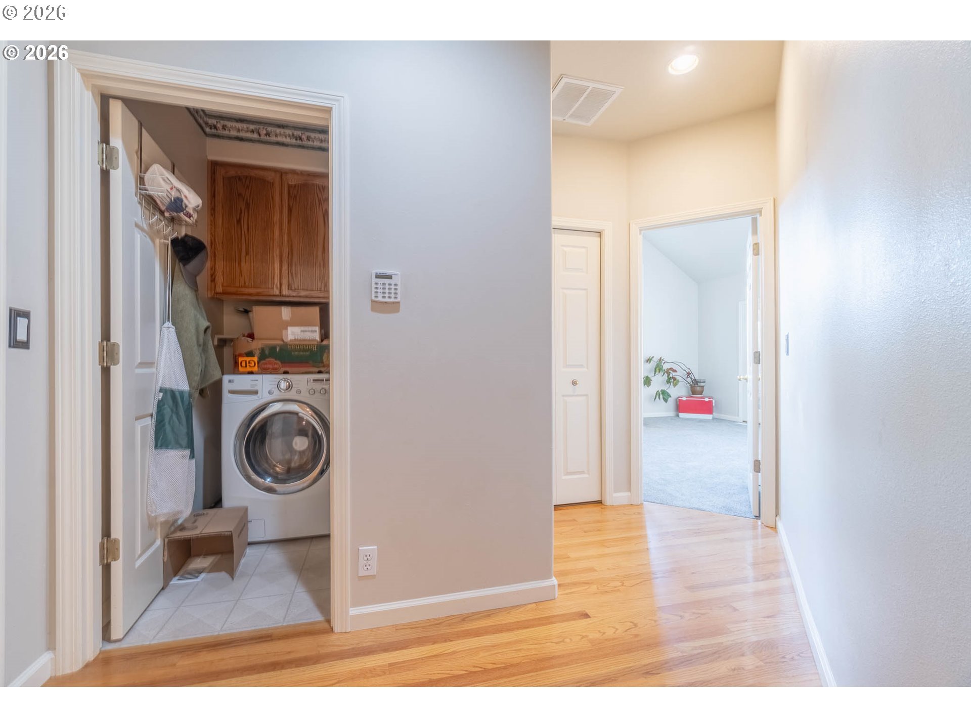 4366 Berry Lane Eugene, OR 97404 - Photo 19 of 36 a view of a hallway with washer and dryer