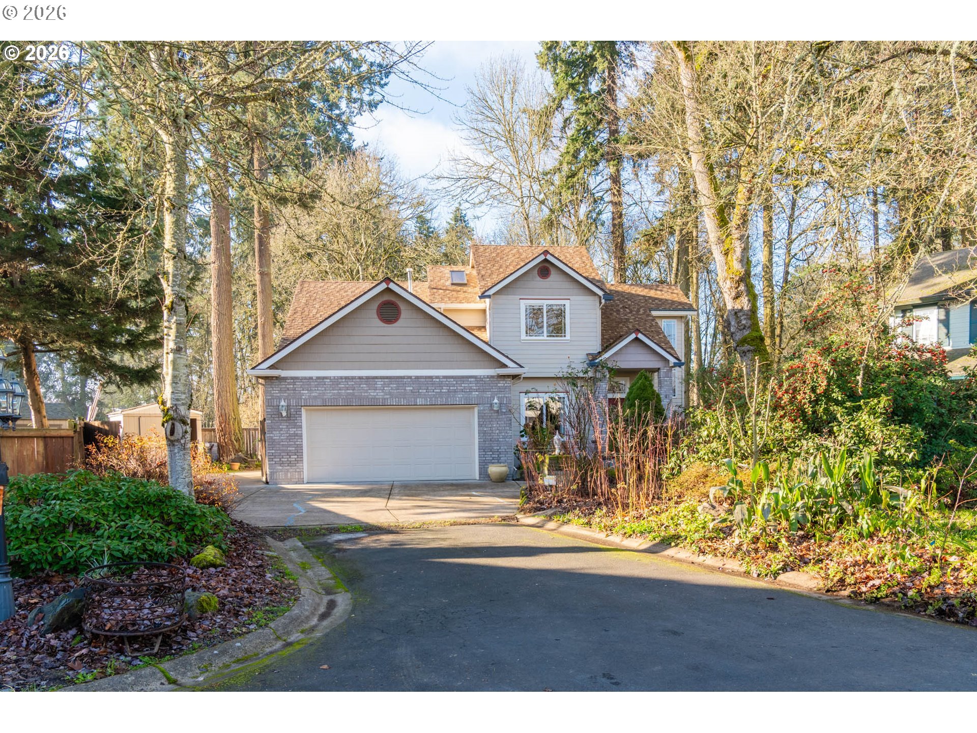 4366 Berry Lane Eugene, OR 97404 - Photo 2 of 36 a view of a house with a big yard and large trees