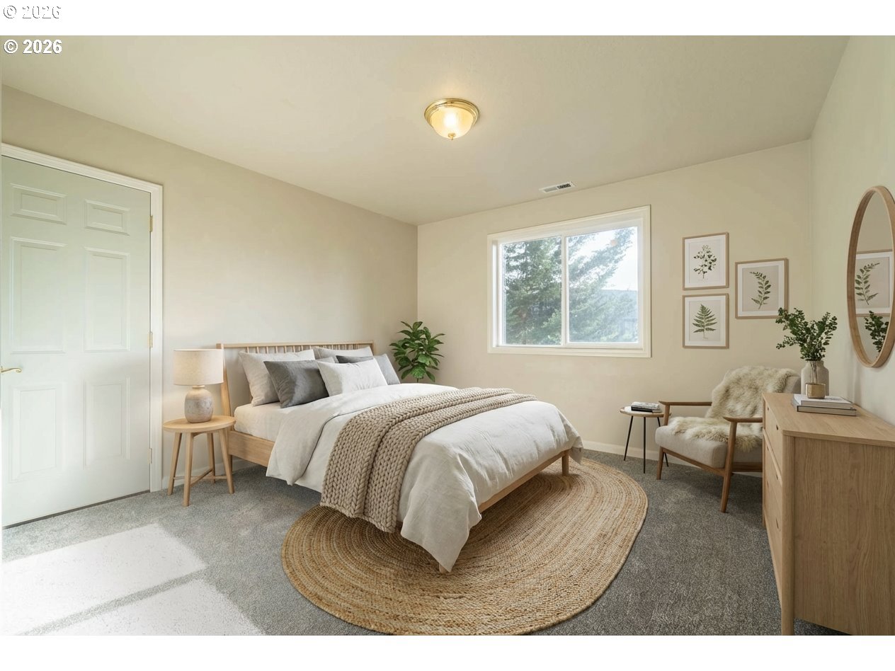 4366 Berry Lane Eugene, OR 97404 - Photo 28 of 36 a spacious bedroom with a bed and window