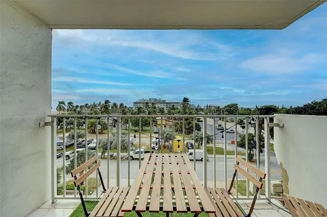 a dining room with furniture window and wooden floor