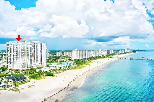 a view of a tall building next to a road