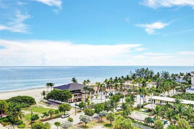 a swimming pool with outdoor seating and yard