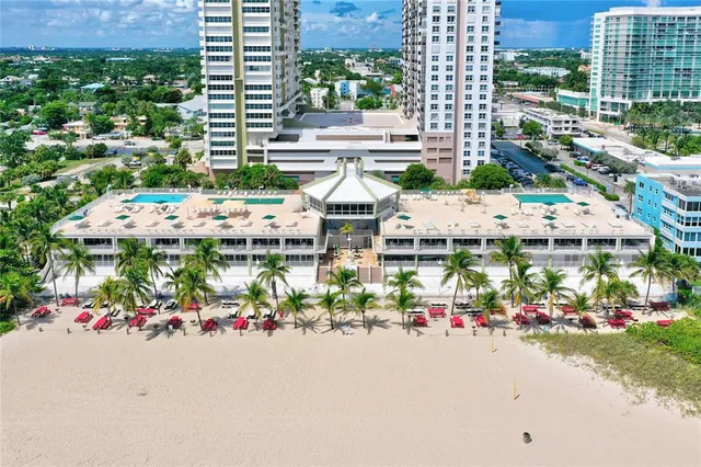 a view of a dining room with furniture wooden floor and chandelier