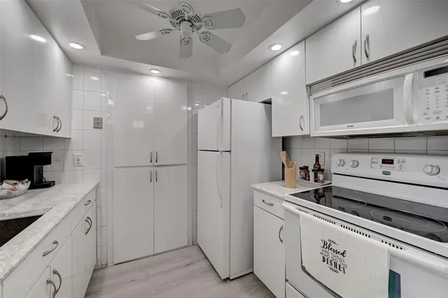 a view of kitchen and dining room with wooden floor