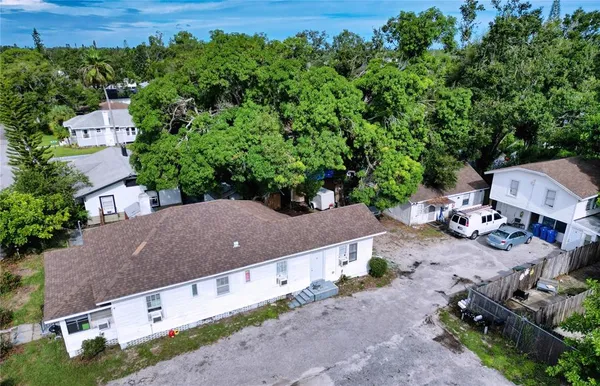 an aerial view of a house with a yard