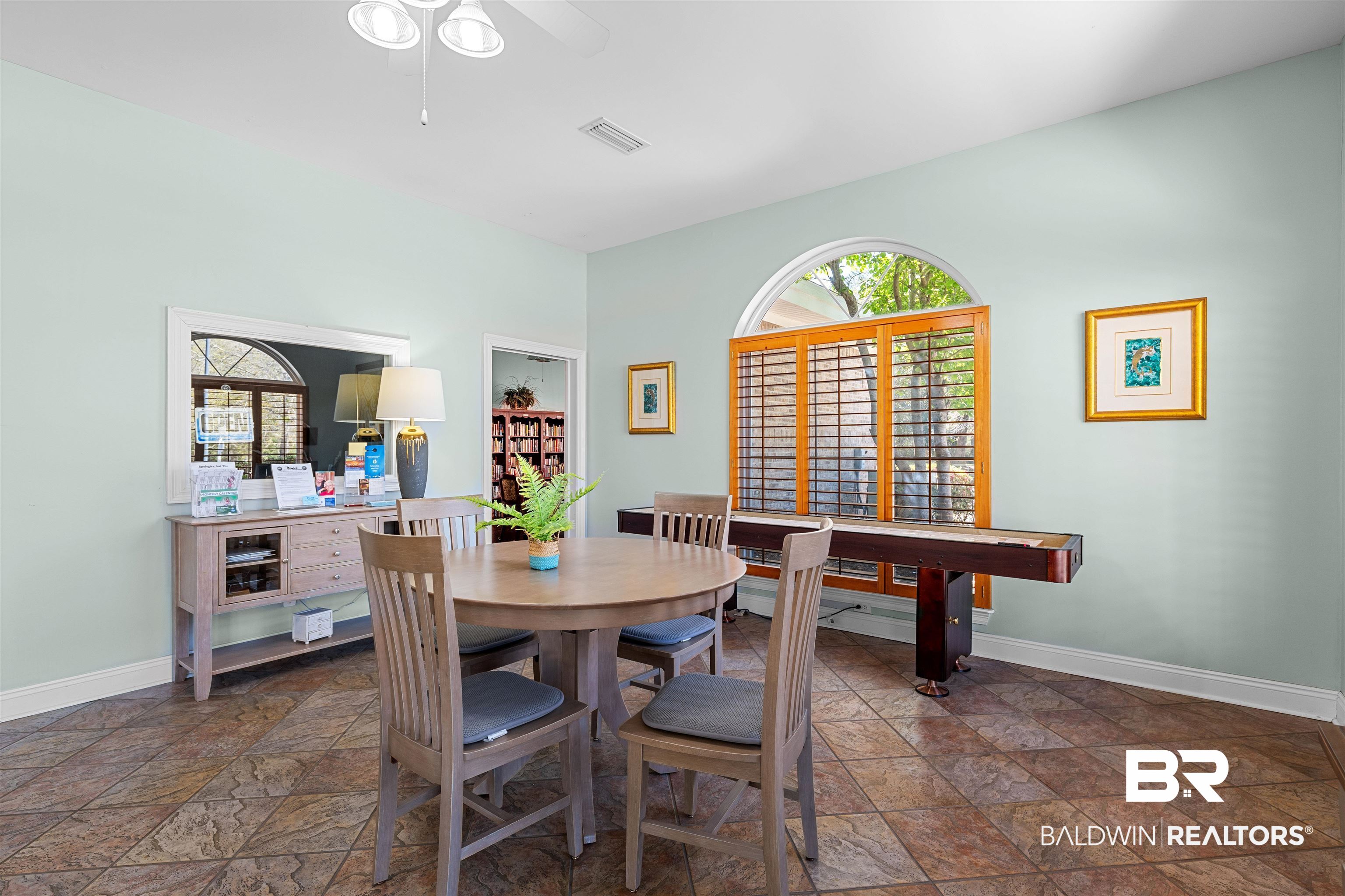 237 Hemingway Loop Foley, AL 36535 - Photo 32 of 49 Dining area featuring stone finish flooring, baseboards, visible vents, and ceiling fan