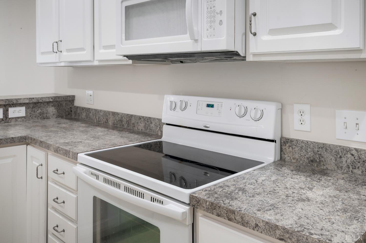 1159 Jefferson Way Forest, VA 24551 - Photo 2 of 43 a kitchen with granite countertop white cabinets and white appliances