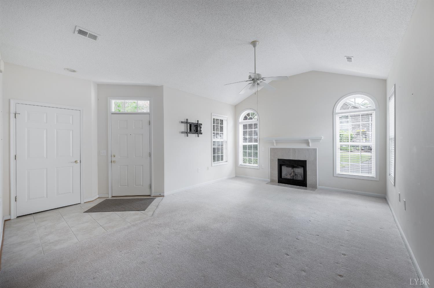 1159 Jefferson Way Forest, VA 24551 - Photo 25 of 43 an empty room with windows fireplace and a bathroom