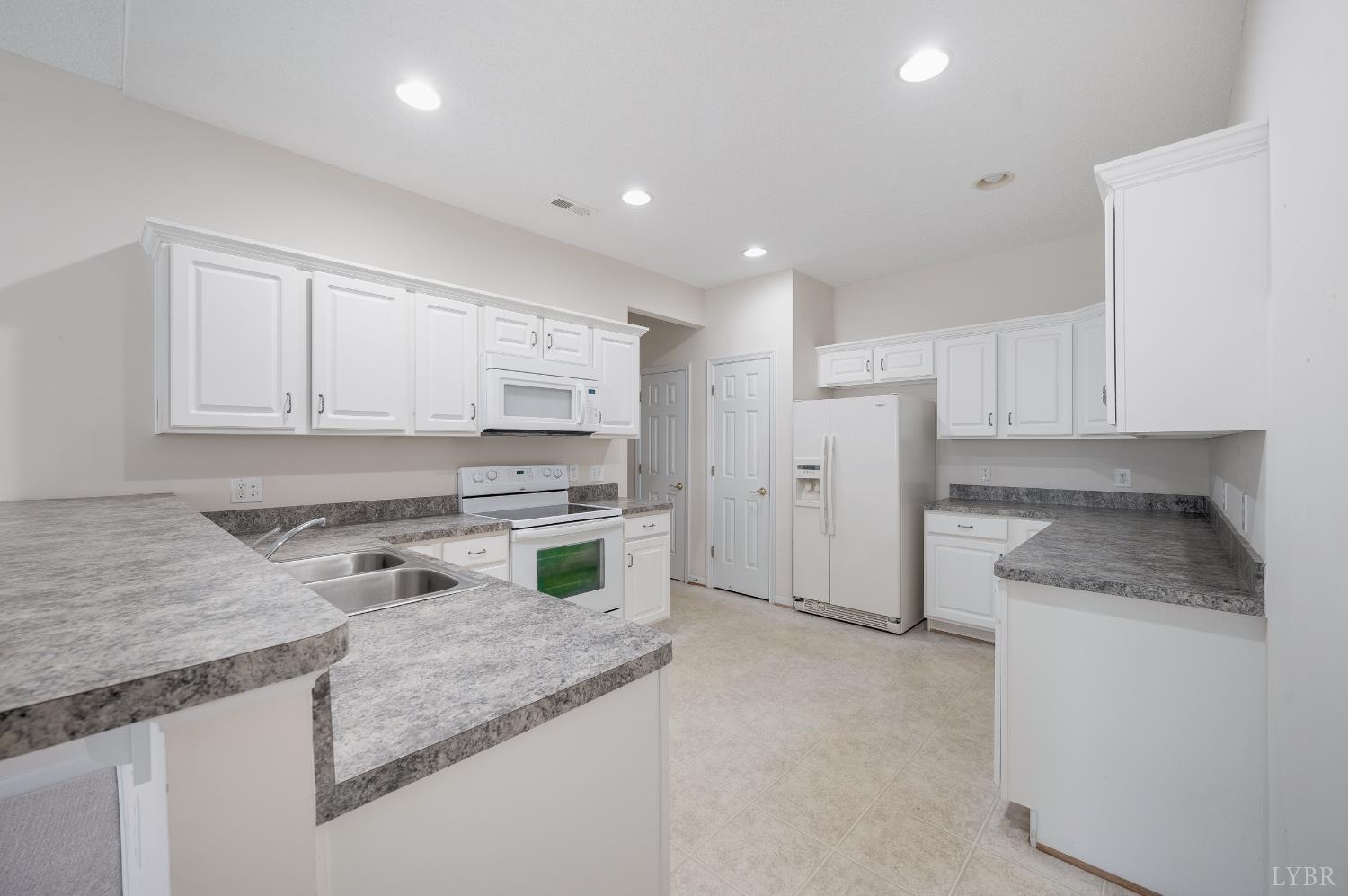 1159 Jefferson Way Forest, VA 24551 - Photo 29 of 43 a kitchen with white cabinets and appliances